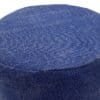 Blå sittpall pouf med rund form och texturerad yta.