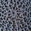Detalj av handstickad pallpuff i jeansblå färg.
