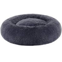 Mjuk och fluffig hundsäng i donutform för lugn och komfort.