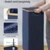 Modern laundry basket with bamboo handles and collapsible design.