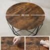Runt träbord med svart metallram, 80 cm diameter, för vardagsrum eller sovrum.