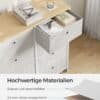 Ljusgrå tygbyrå med 8 lådor och metallram i modern design.
