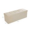 Fällbar förvaringsbänk i beige med stoppad sits och lock.