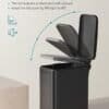 Modern svart papperskorg med lock och soft-close funktion.